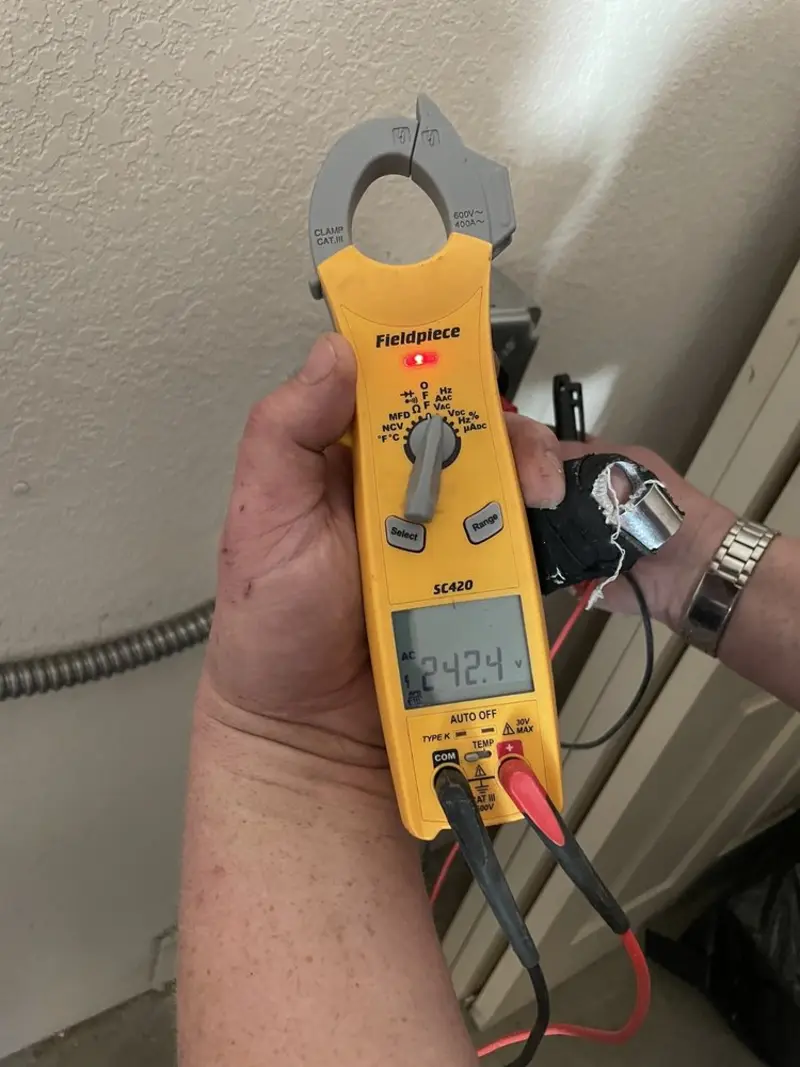 Voltage testing with clamp meter during Outlet Installation in Conway